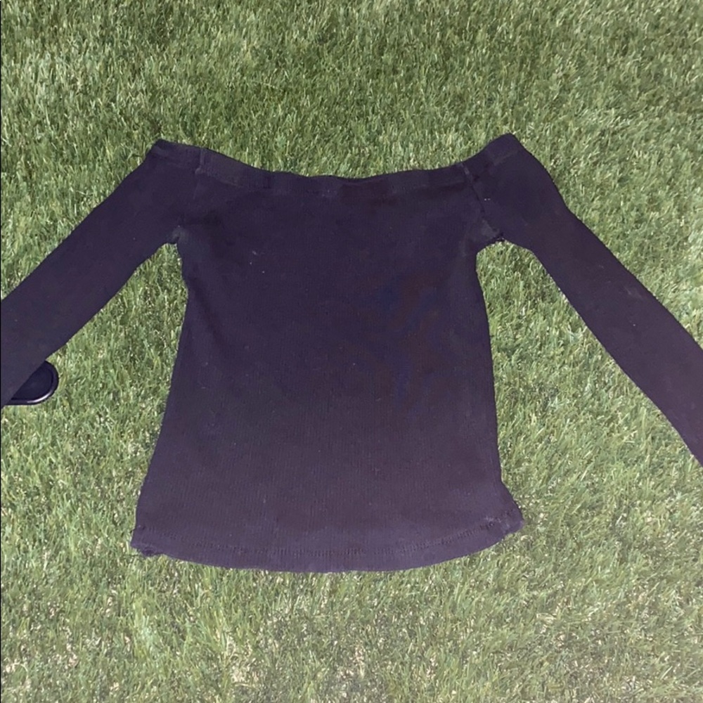 Black off the shoulder shirt.